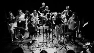 Group of young people performing on stage